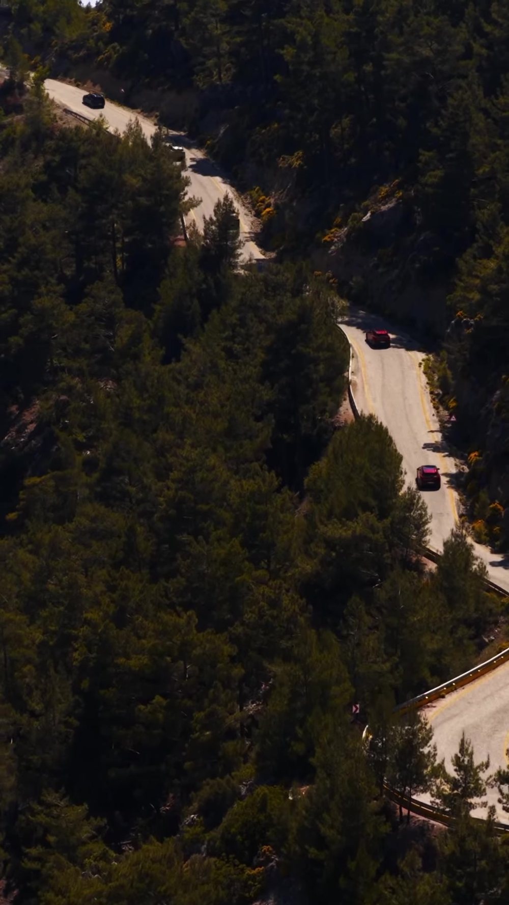 A convoy on the winding road above Faralya