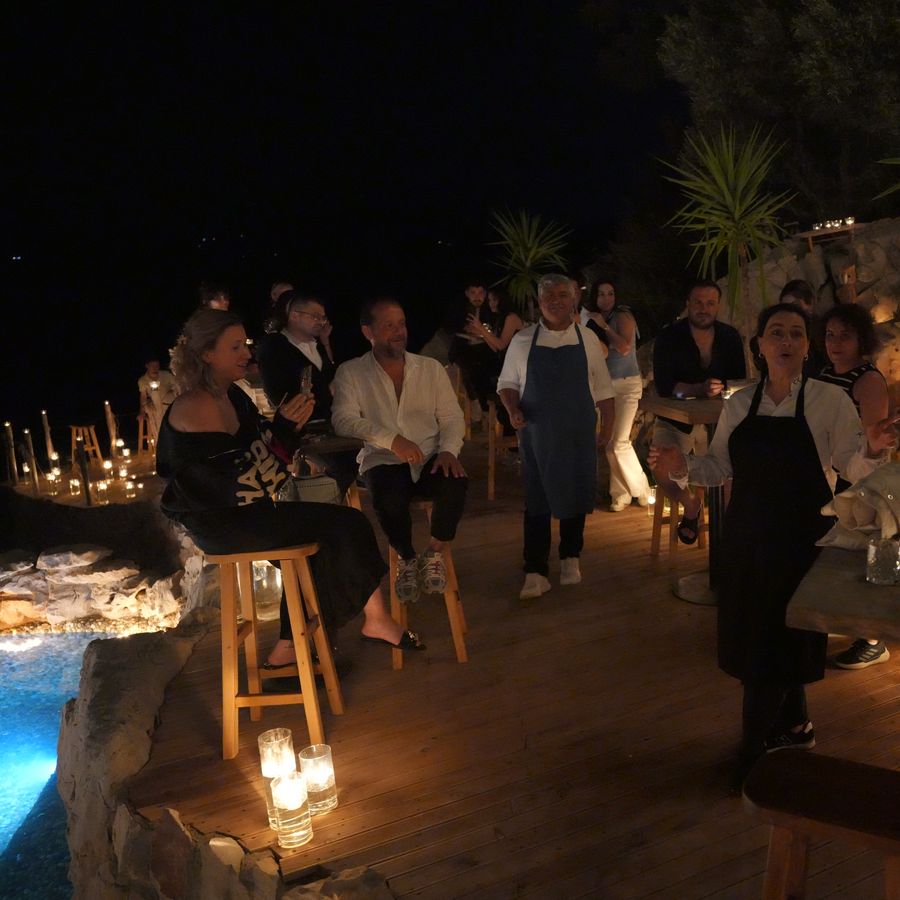 Candlelit tables under the night sky at Perdue